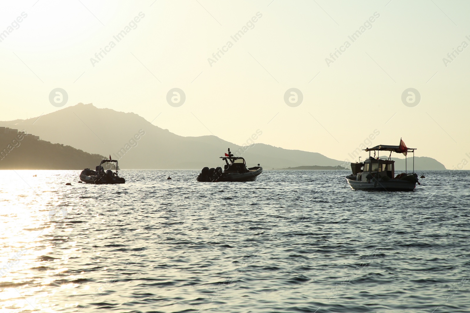 Photo of Picturesque view of calm sea with boats on sunny day