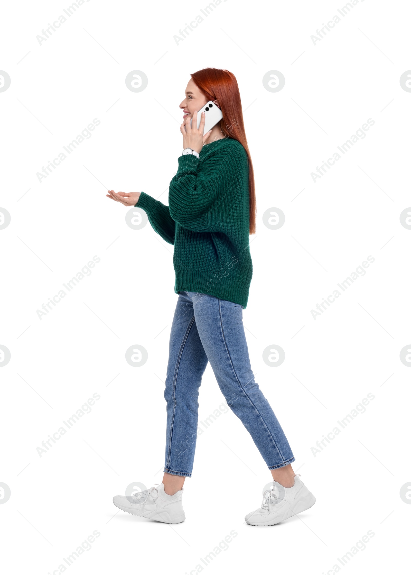 Photo of Happy woman talking on smartphone against white background