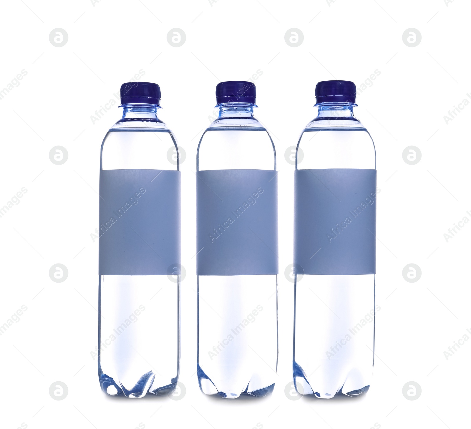 Photo of Plastic bottles with soda water on white background