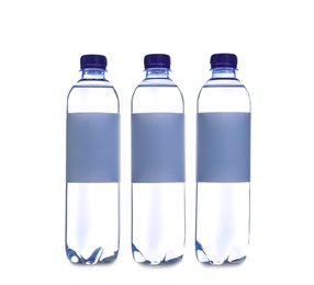 Plastic bottles with soda water on white background