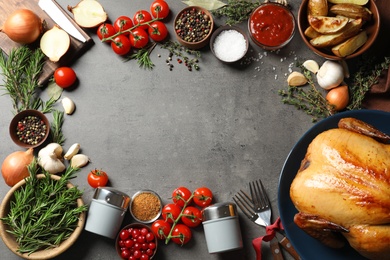 Photo of Frame of cooked turkey with vegetables, herbs and spices on grey background, flat lay. Space for text