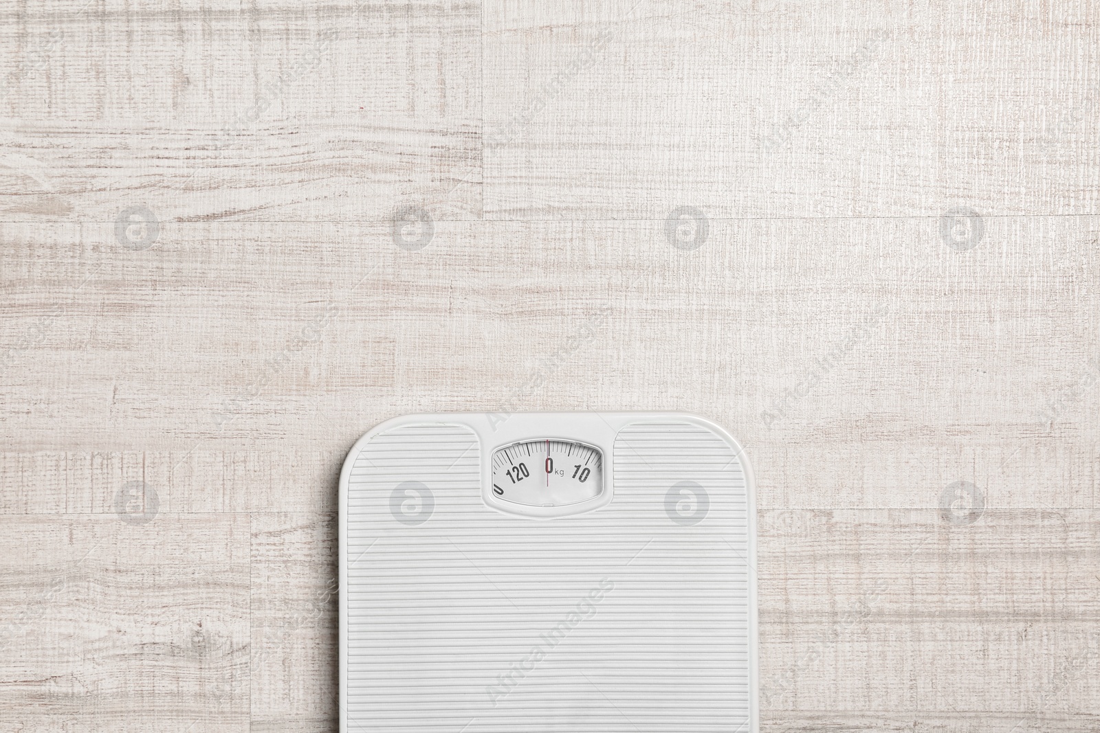 Photo of Bathroom scales and space for text on wooden background, top view. Weight loss concept