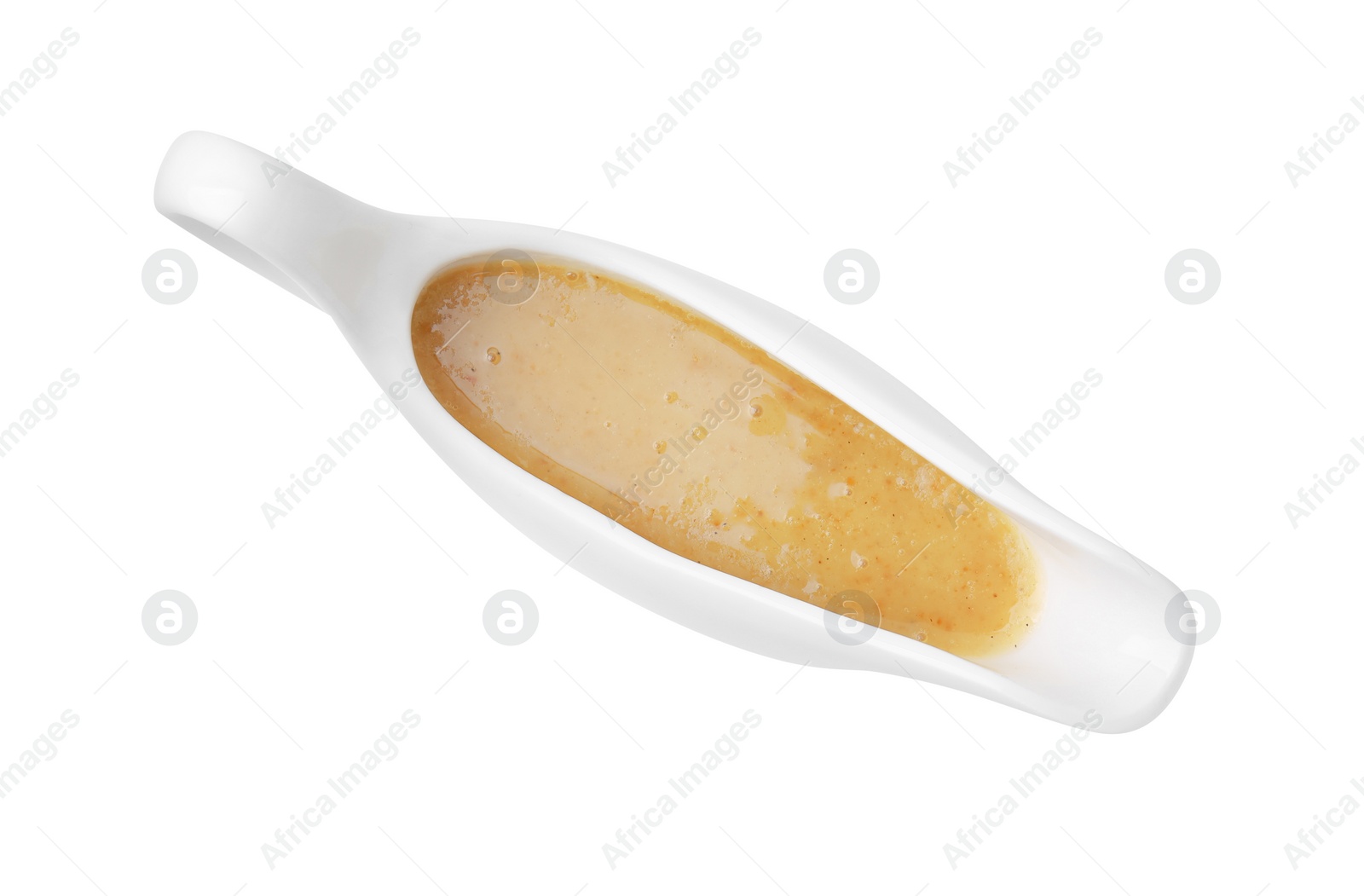 Photo of Delicious turkey gravy in sauce boat isolated on white, top view