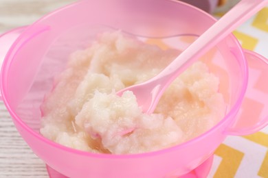 Photo of Healthy baby food. Bowl with cauliflower puree on table, closeup