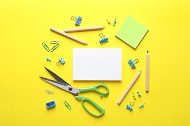 Photo of Flat lay composition with scissors and office supplies on color background. Space for text