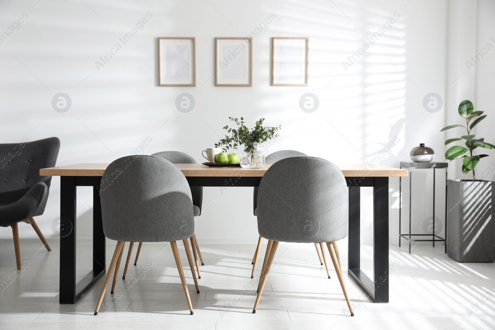 Photo of Stylish room interior with table and chairs. Idea for design