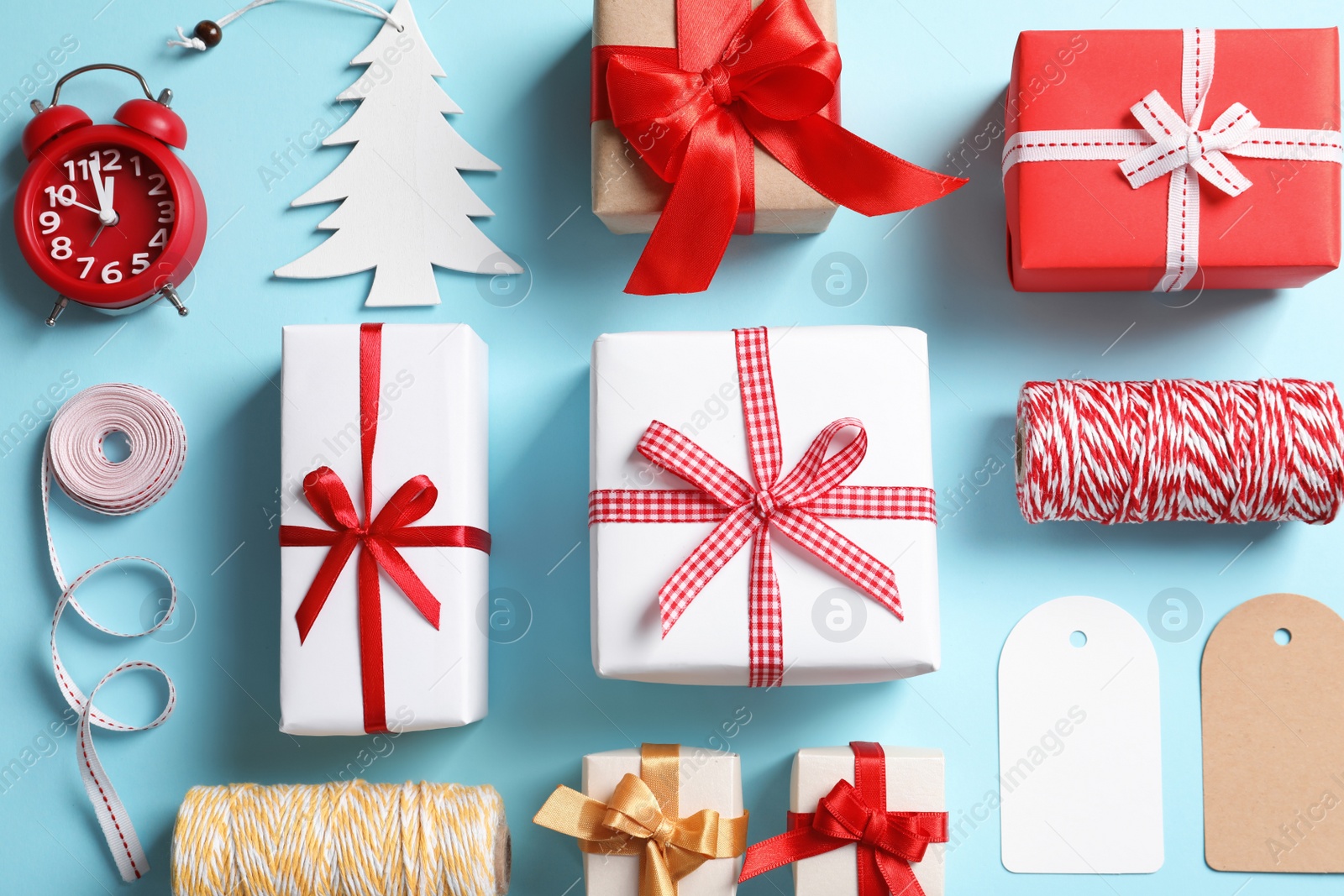 Photo of Flat lay composition with gift boxes on color background, top view