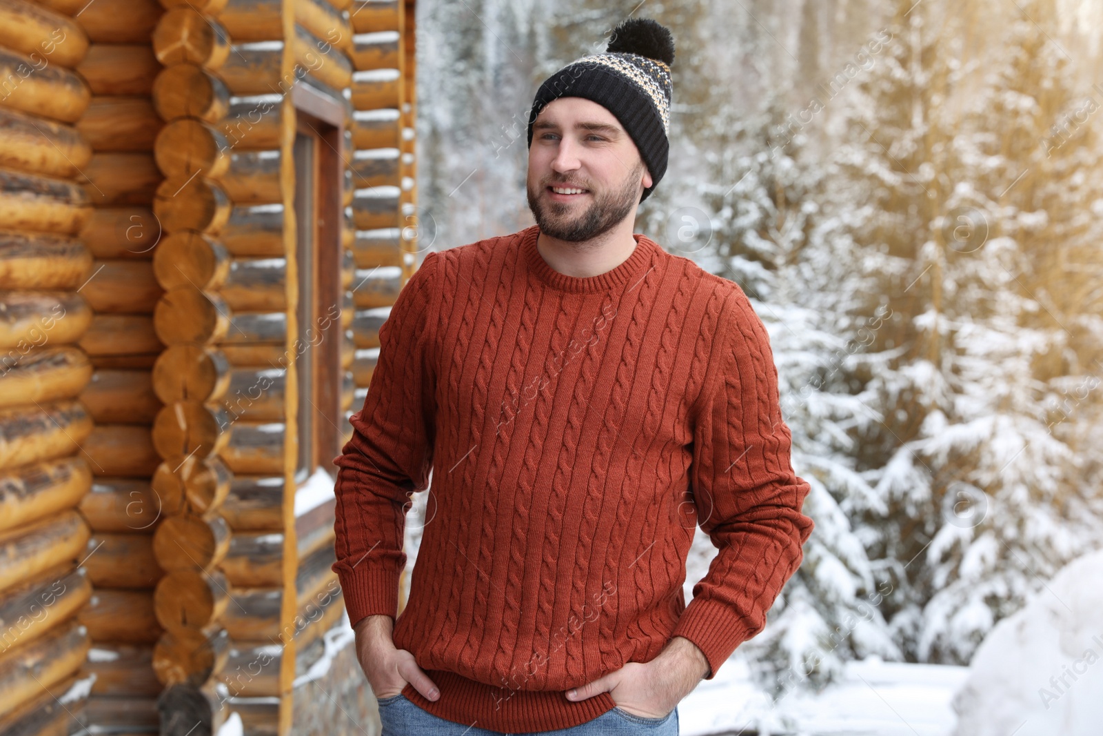 Photo of Happy man in warm sweater outdoors on winter day