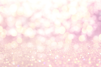 Blurred view of pink glitter as abstract background, bokeh effect