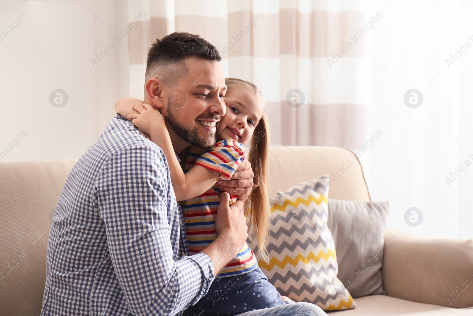 Photo of Dad and daughter spending time together at home. Happy Father's Day