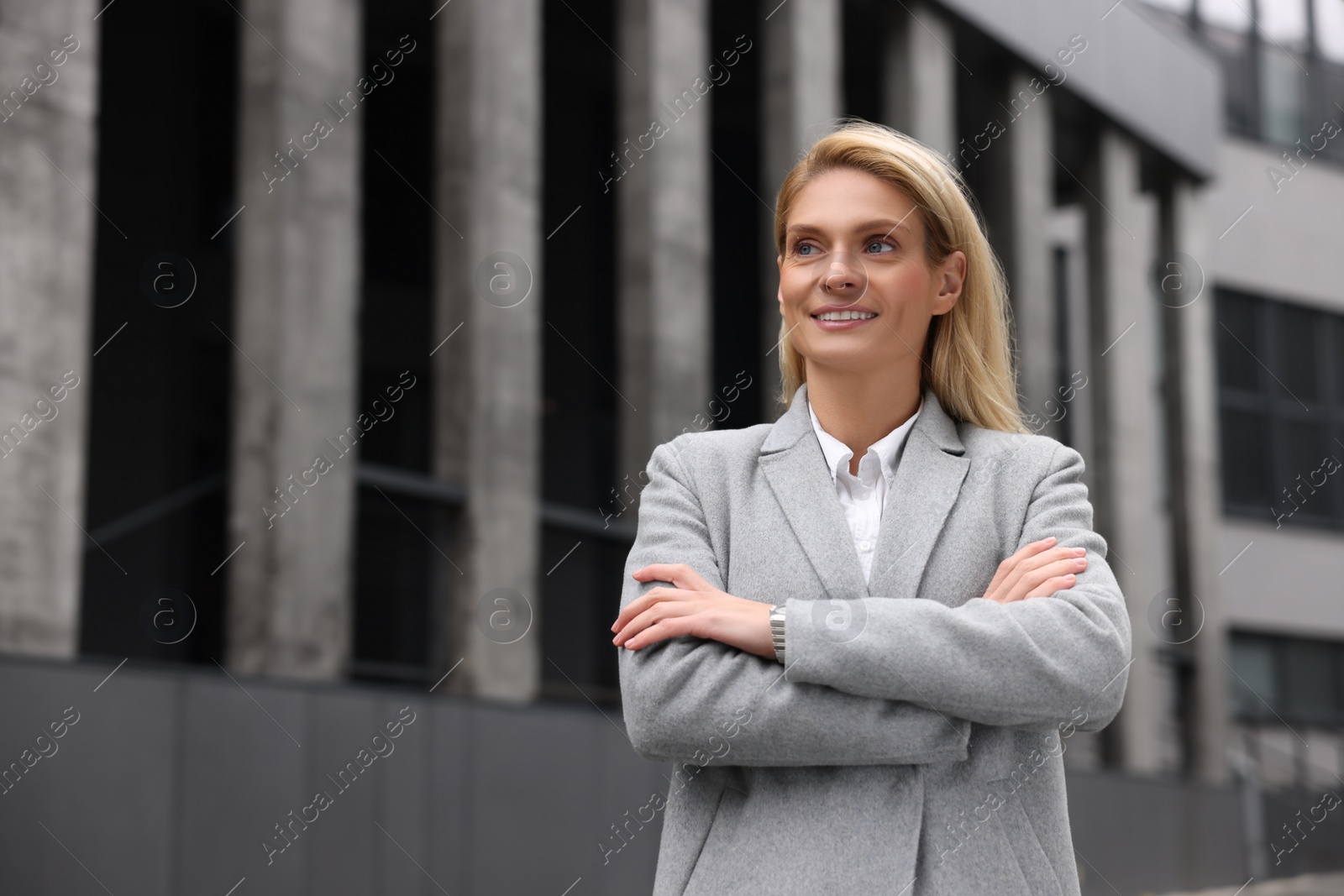 Photo of Portrait of happy woman outdoors, space for text. Lawyer, businesswoman, accountant or manager