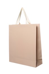 One beige shopping bag isolated on white