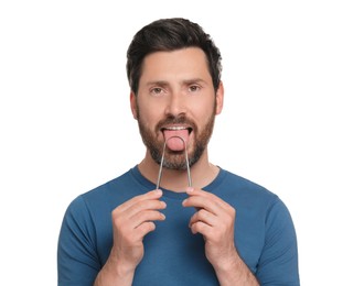 Handsome man brushing his tongue with cleaner on white background