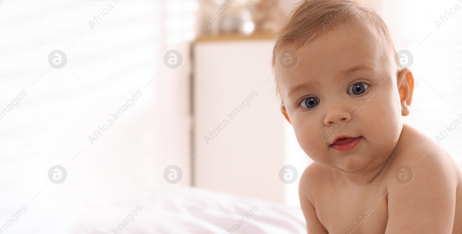 Image of Portrait of cute little baby at home, space for text. Banner design
