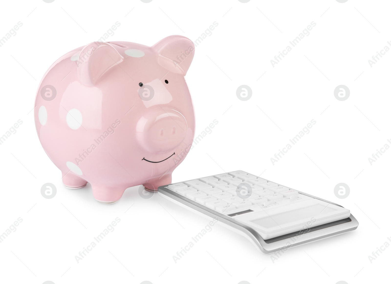 Photo of Calculator and pink piggy bank isolated on white