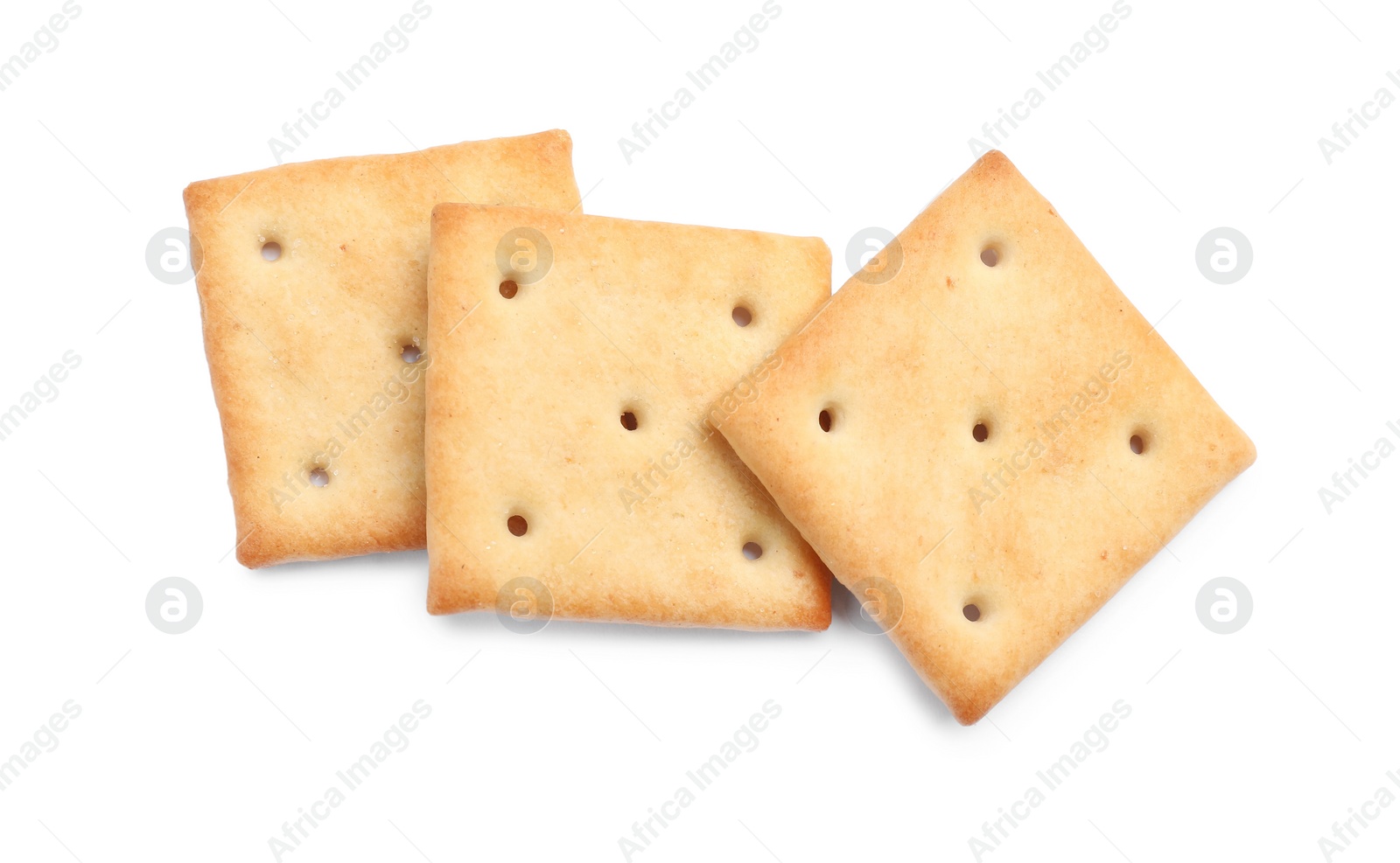 Photo of Tasty crispy square crackers isolated on white, top view