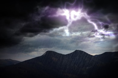 Image of Thunderstorm in mountains. Lightnings and heavy rain