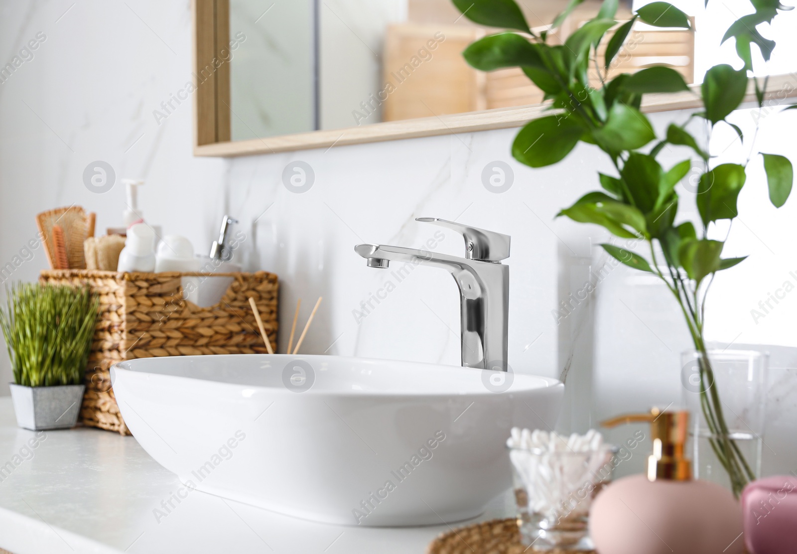 Photo of Modern vessel sink with faucet in stylish bathroom