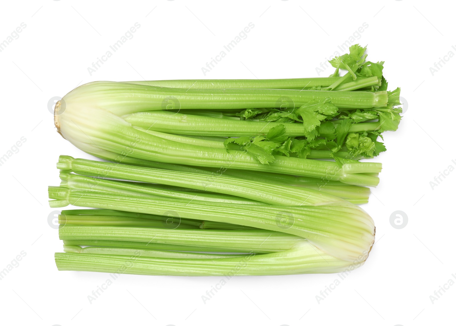 Photo of Fresh green celery bunches isolated on white, top view