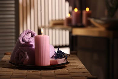 Photo of Beautiful composition with different spa products on wicker bench indoors, space for text