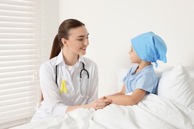 Photo of Childhood cancer. Doctor and little patient in hospital