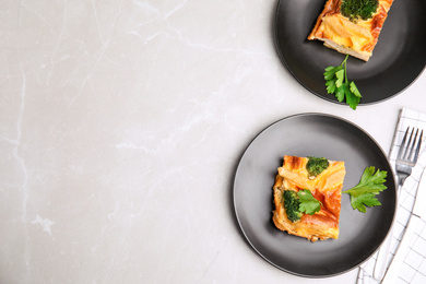 Tasty broccoli casserole served on grey marble table, flat lay. Space for text