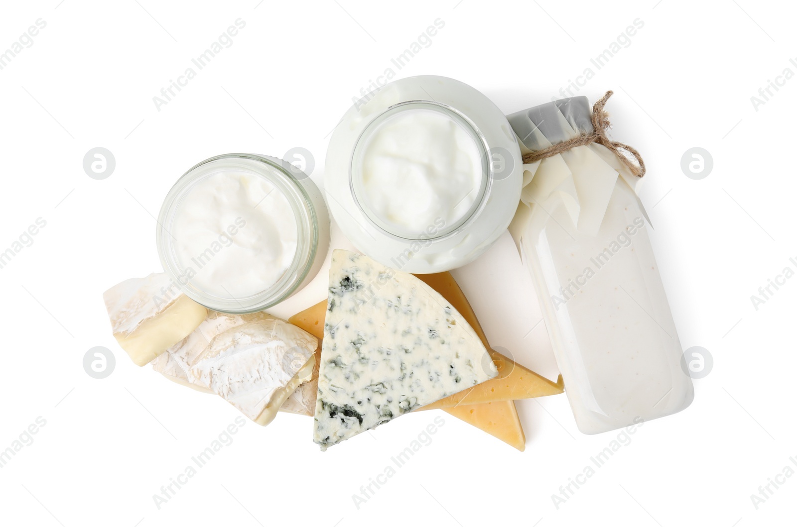 Photo of Different fresh dairy products isolated on white, top view