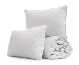 Soft blanket with pillows on white background