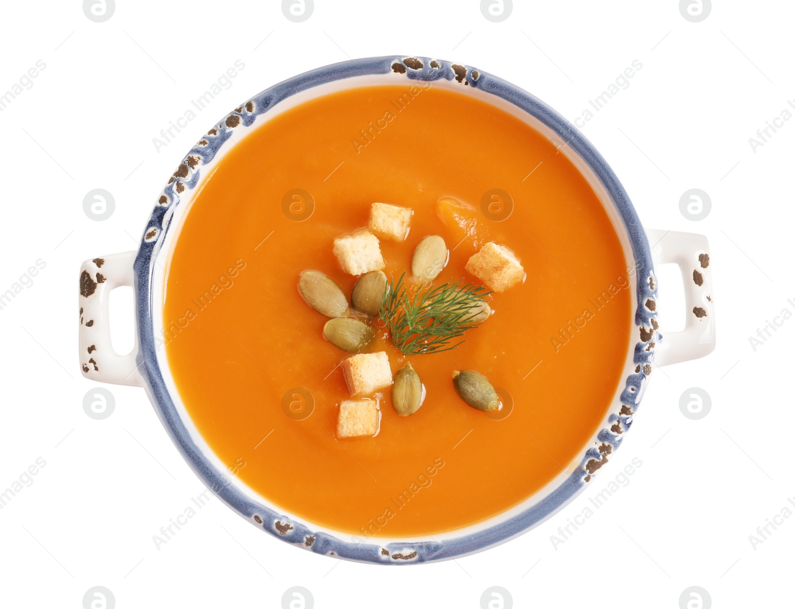Photo of Bowl of tasty sweet potato soup isolated on white, top view