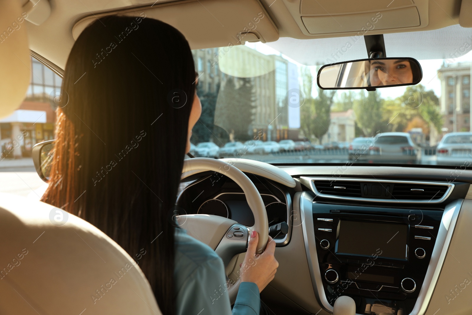 Photo of Beautiful young driver sitting in modern car