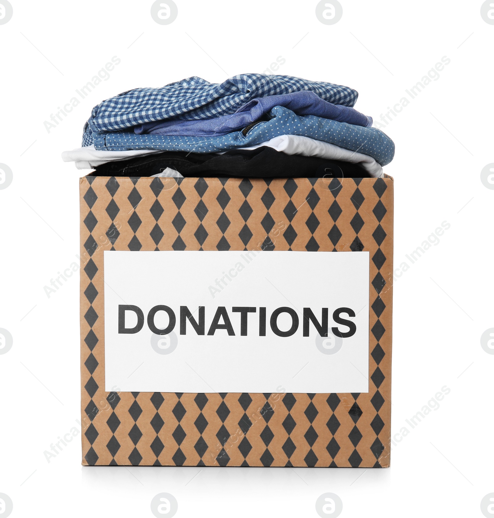 Photo of Donation box with clothes on white background