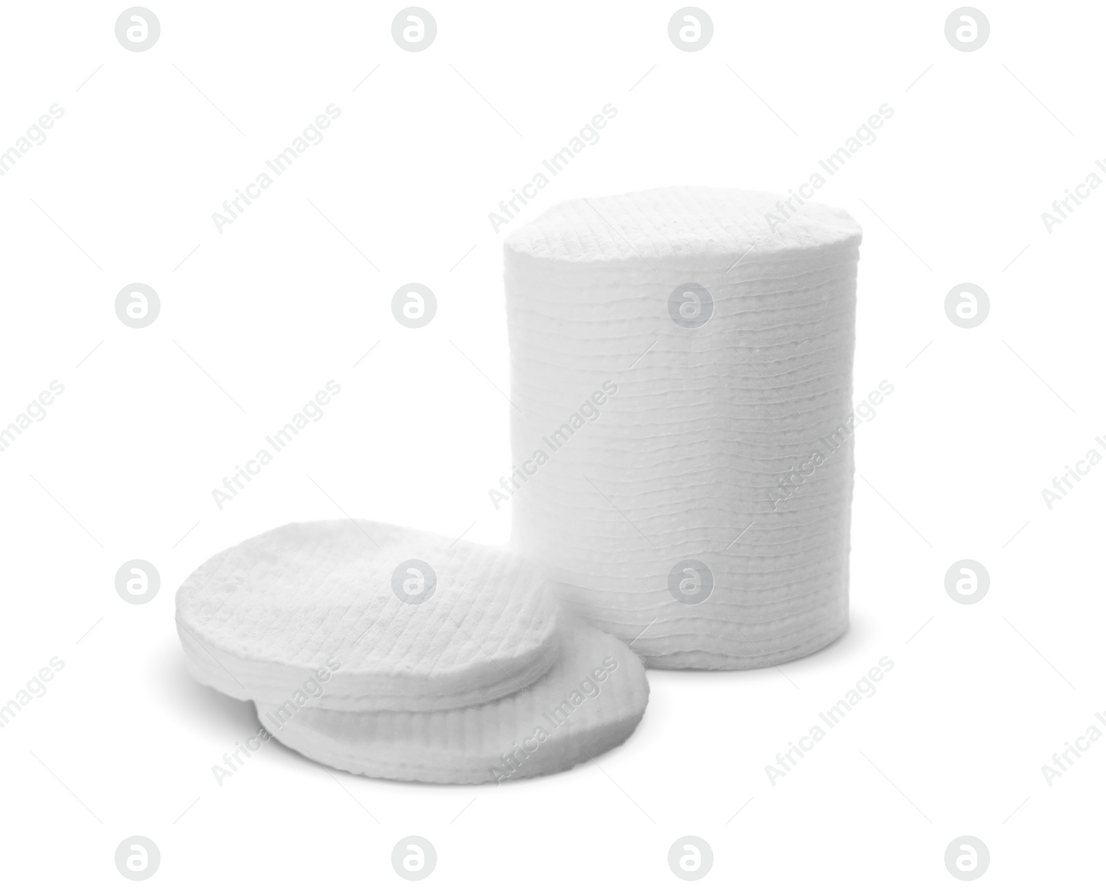 Photo of Piles of cotton pads on white background