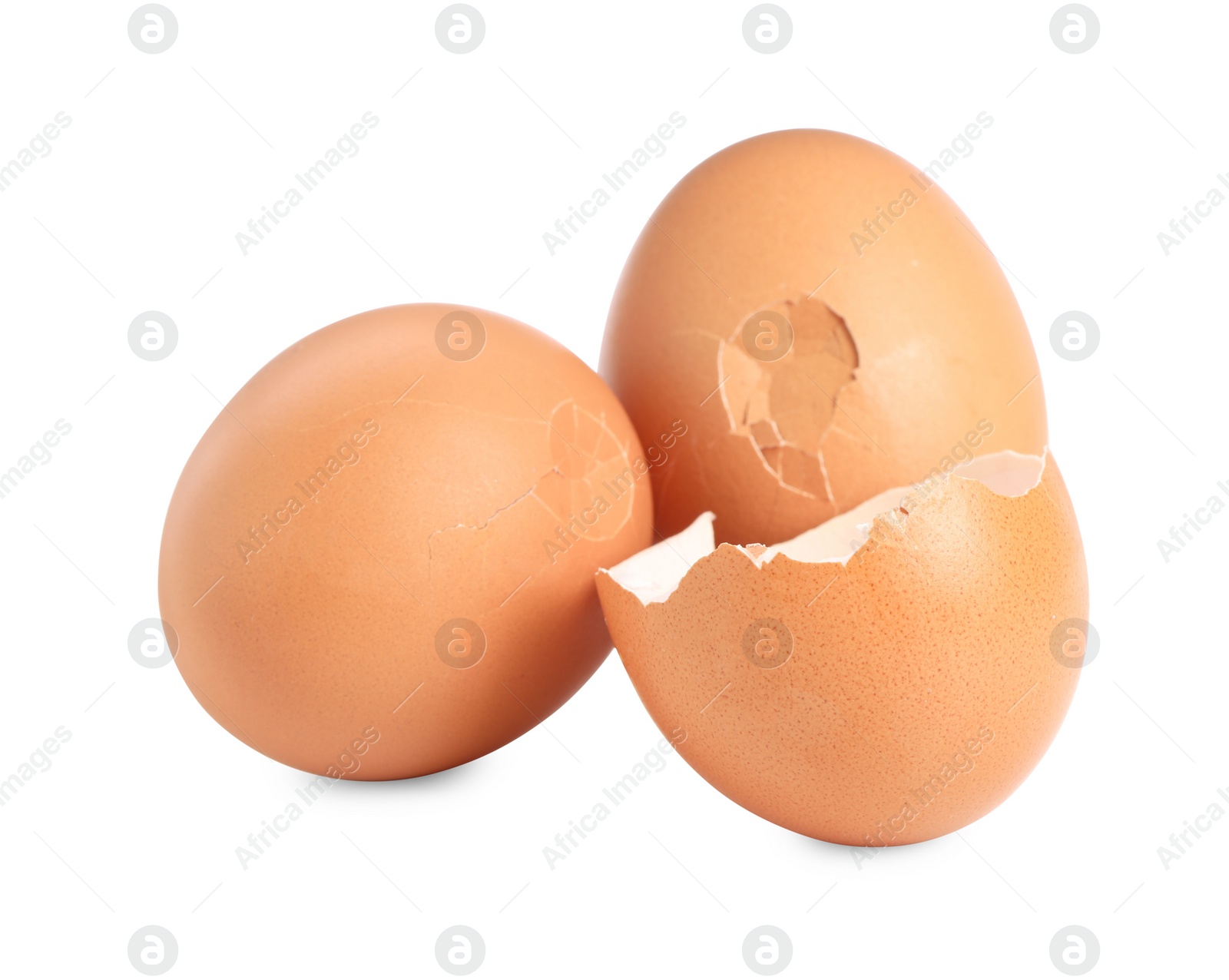 Photo of Whole and cracked chicken eggs isolated on white