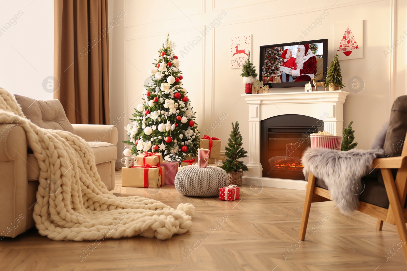 Image of Stylish living room interior with TV set, Christmas tree and fireplace