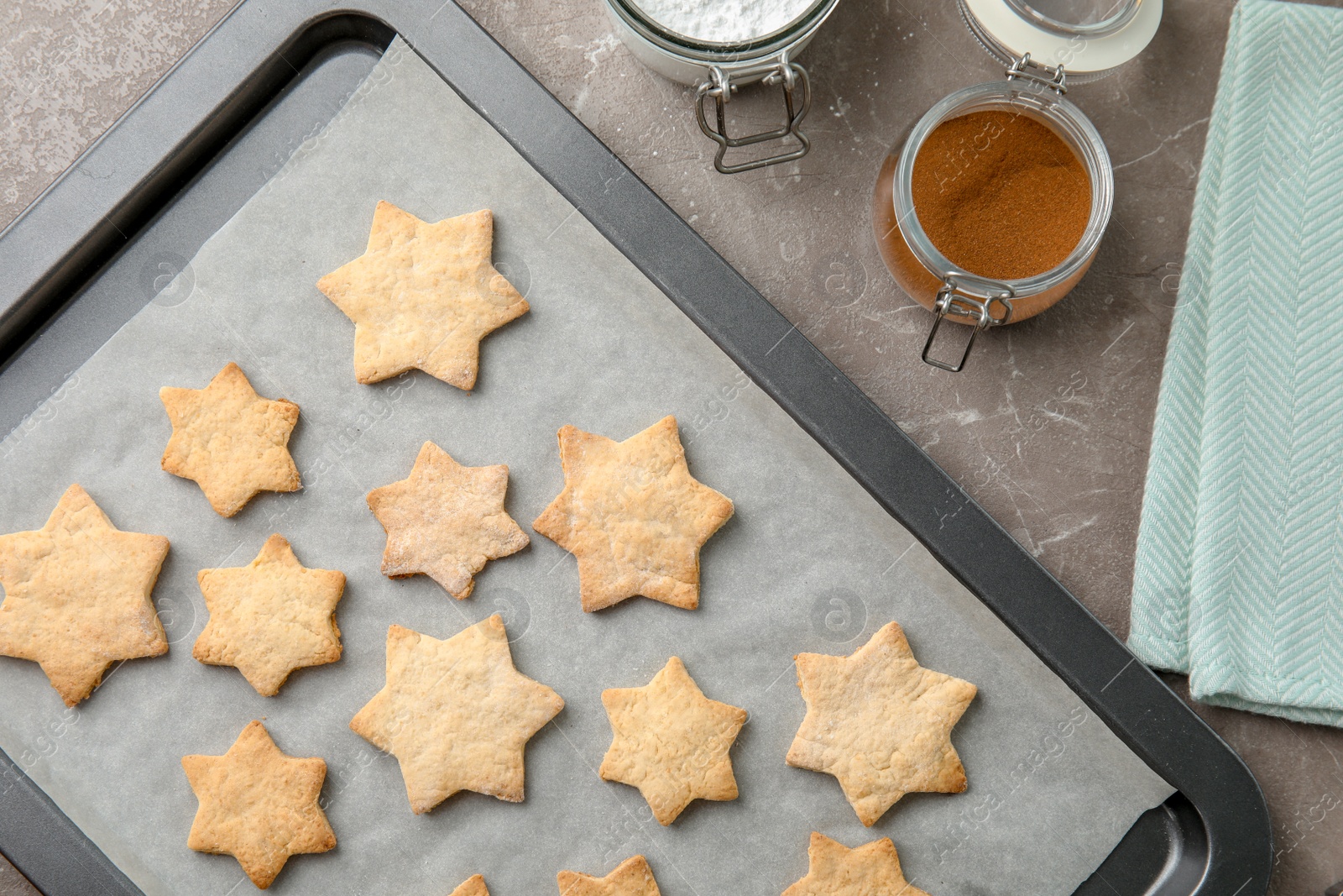 Photo of Tasty homemade Christmas cookies on baking tray, top view