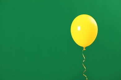 Photo of Bright balloon on color background, space for text. Celebration time