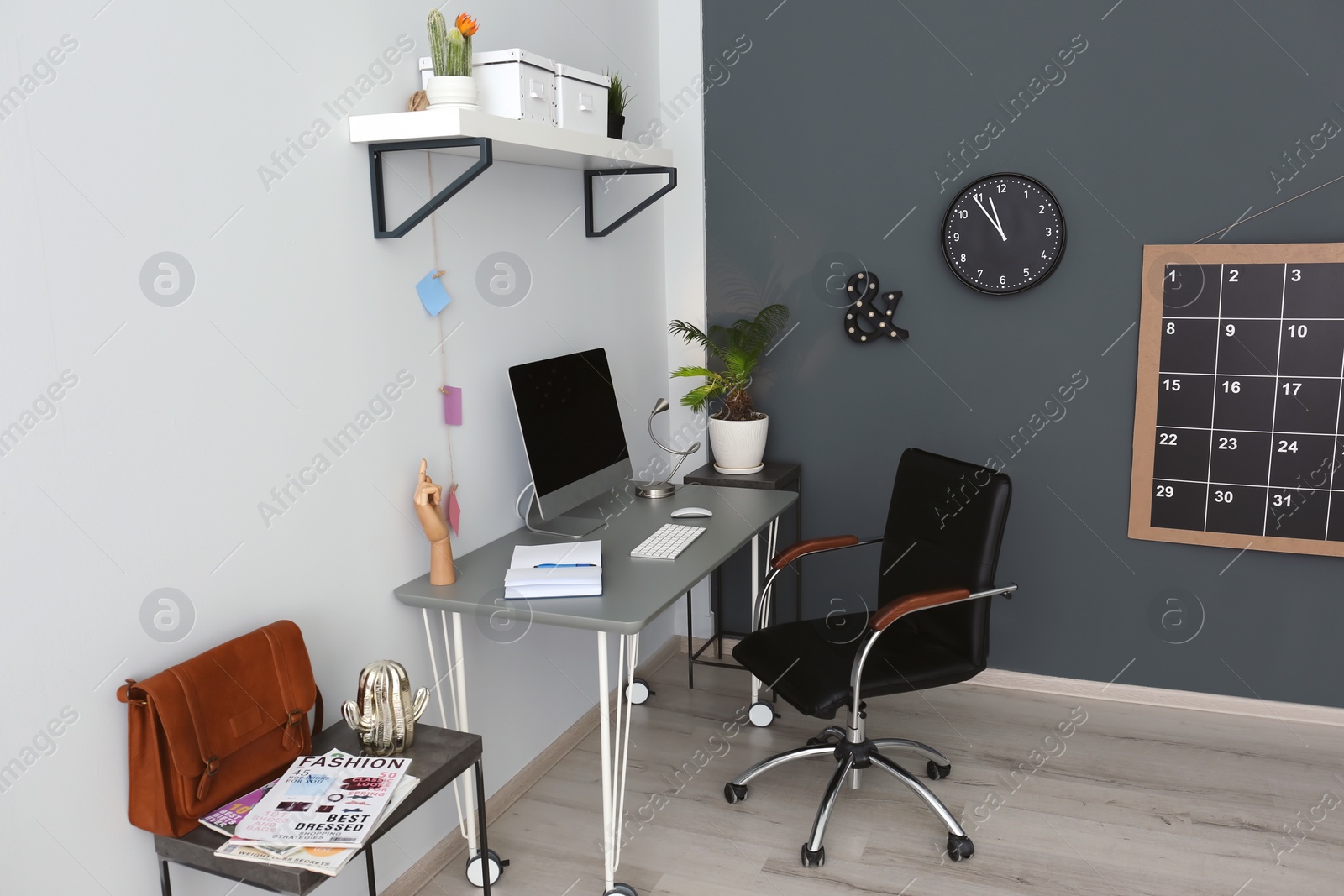 Photo of Comfortable workplace with computer on desk in home office