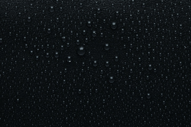 Photo of Water drops on black background, top view