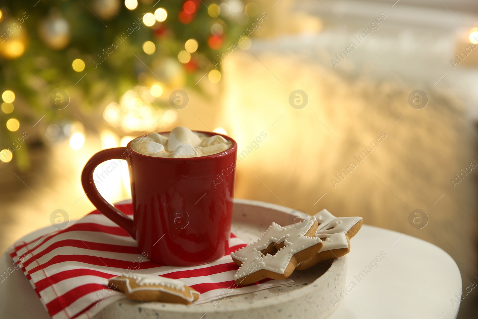 Photo of Cup of hot  drink on white table indoors