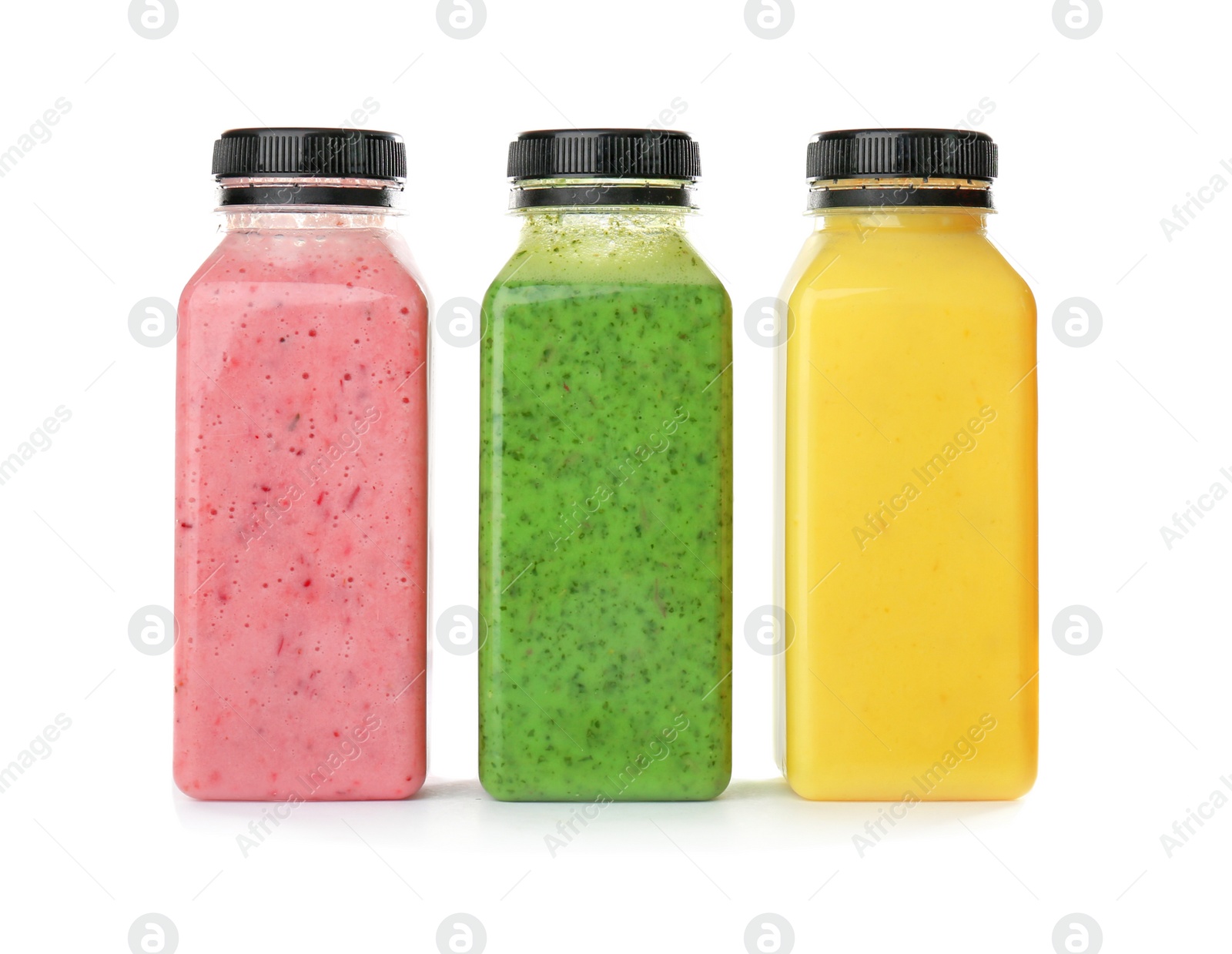 Photo of Bottles with delicious detox smoothies on white background