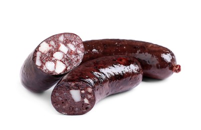 Photo of Cut and whole tasty blood sausages on white background