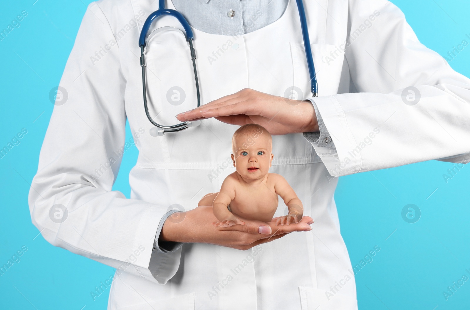 Image of Surrogacy concept. Doctor holding cute little baby on blue background, closeup