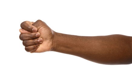 Photo of African-American man showing fig gesture on white background, closeup