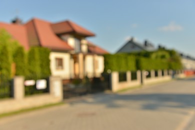 Photo of Blurred view of beautiful houses on sunny day