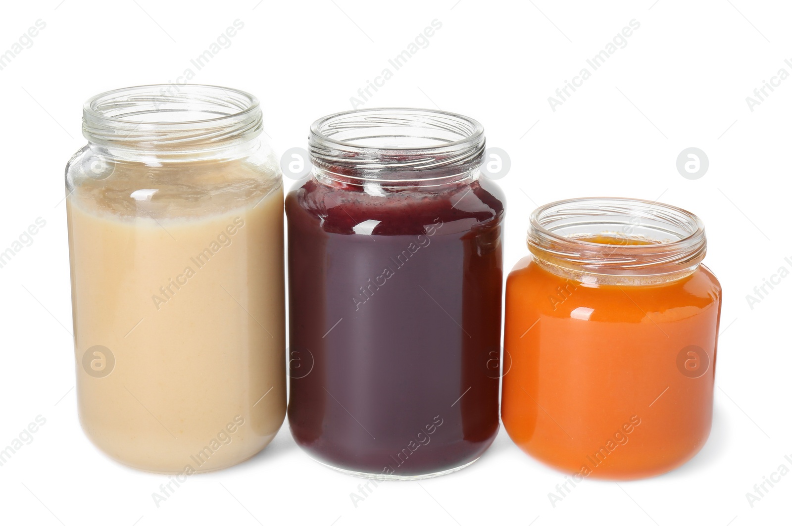 Photo of Baby food. Different healthy puree in jars isolated on white