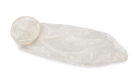Photo of Unrolled condom on white background, top view. Safe sex