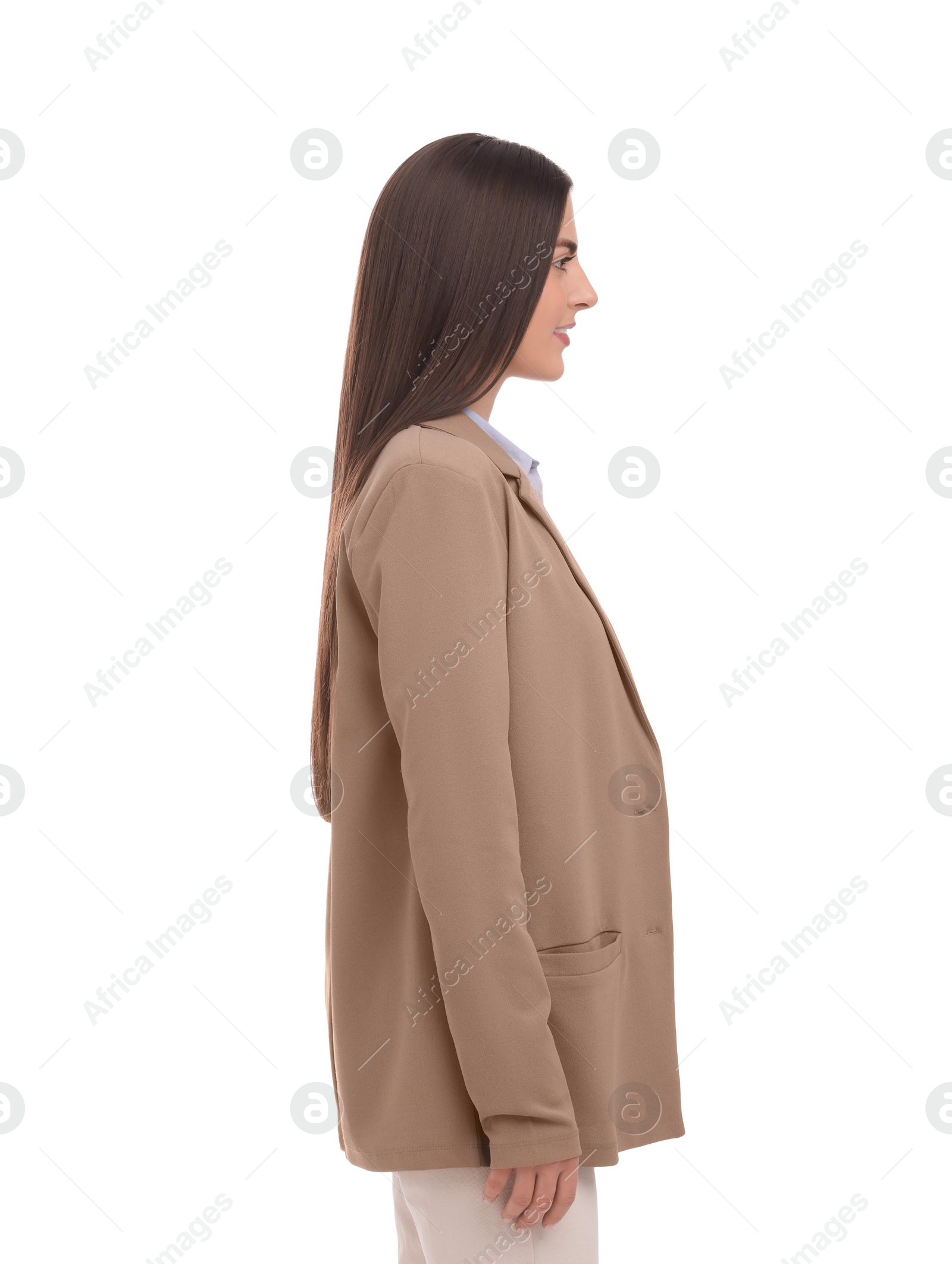 Photo of Young businesswoman in suit standing on white background