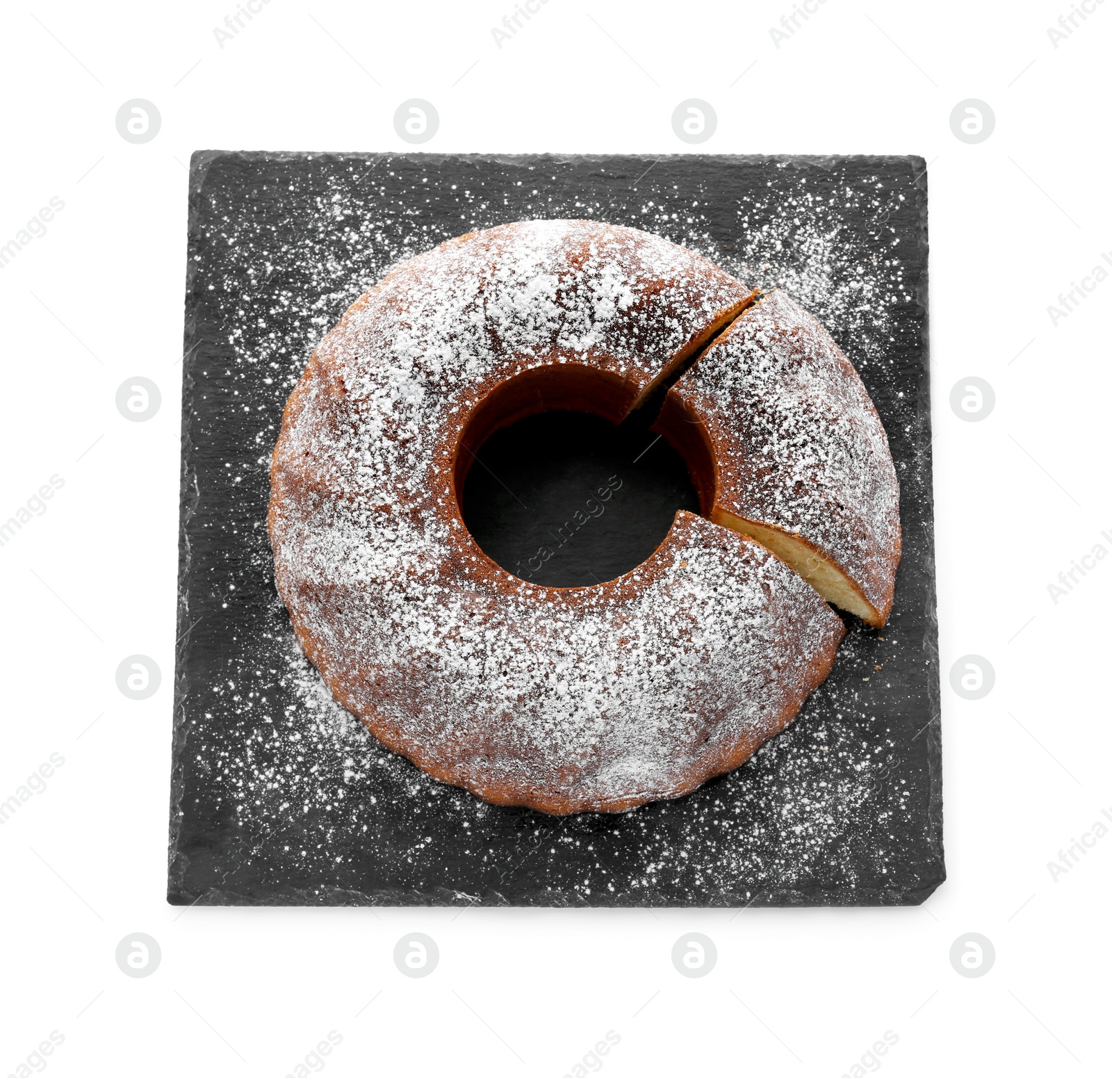 Photo of Homemade yogurt cake with powdered sugar on white background, top view