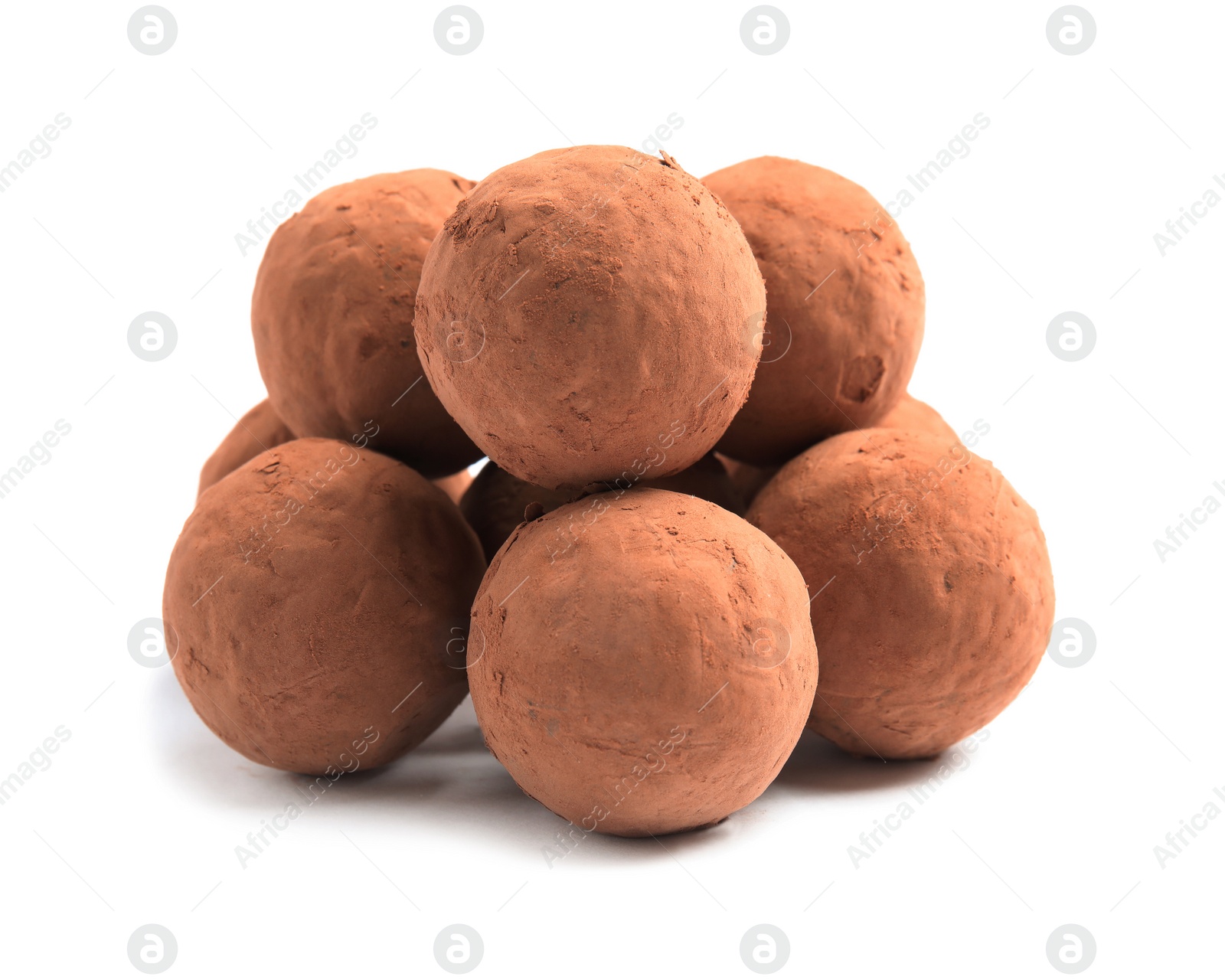 Photo of Delicious raw chocolate truffles on white background