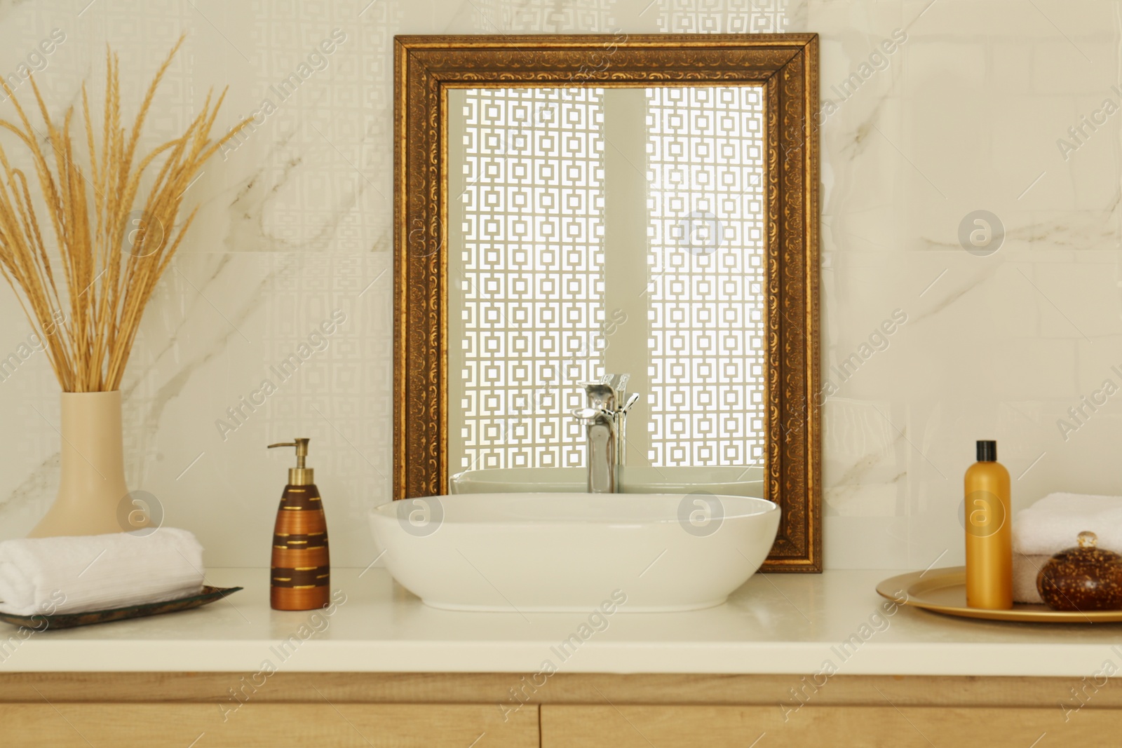 Photo of Vintage mirror and vessel sink in stylish bathroom